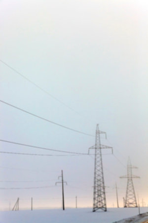 photographed close up, high voltage electric poles, out of focus