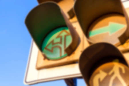 photographed close-up of a traffic light to regulate traffic at the intersection, defocusの写真素材