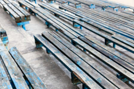 photographed close-up of an old crumbling, rotten wooden benches, defocusedの写真素材