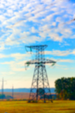 photographed close up, high voltage electric poles, out of focus