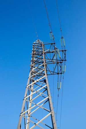 photographed close-up, high-voltage electric poles located in the countryside
