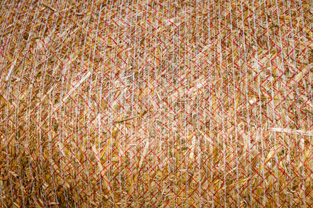 photographed close-up background stack of straw after the harvest of cereal cropsの写真素材