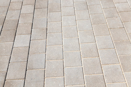 photographed close-up of the pedestrian road made of concrete tiles