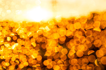 orange circles. Photo of water drops on glass at sunset, which formed bokeh, defocusedの写真素材