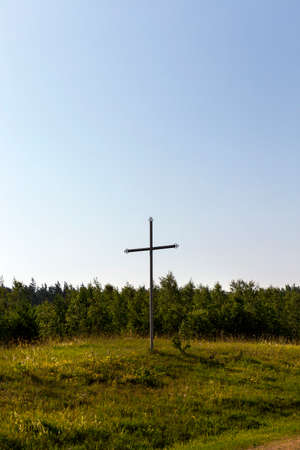 photographed close-up of old metal rusty Orthodox cross, located in the open air. Focus on the crossの写真素材