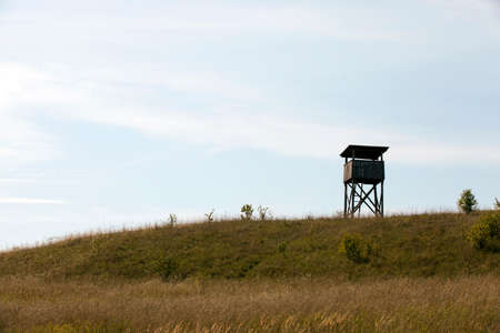 wooden tower, located on a hill. The photo was taken in cloudy weatherの写真素材