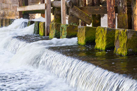 fixing the old damの写真素材