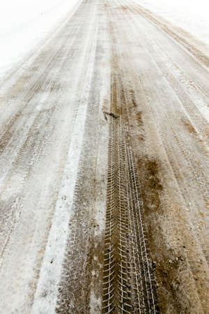 traces of the car on snowの写真素材