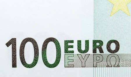 one hundred euros of the European union photographed close-up. Focus on the number one hundred 100 and the inscription of the euroの写真素材