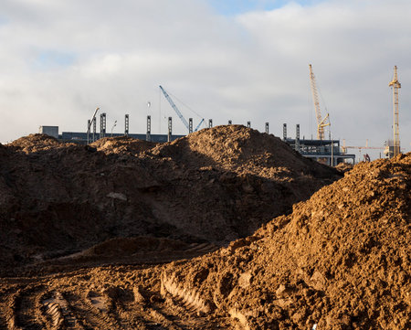 a photo taken at the site of construction of a new building. Dirt on the construction site