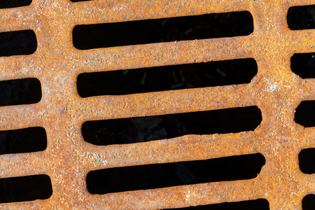 Rusty metal sewer grating, Photo close up
