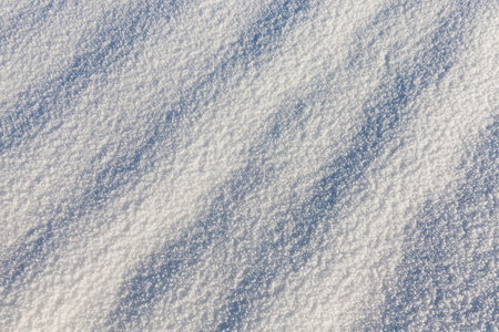 The surface of Real white and beautiful snow after snowfall. The surface of the snow forms shadows...