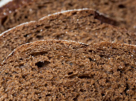 black bread, sliced. photo side view close upの写真素材