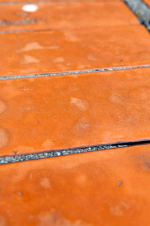 close-up photos of old steps of red color necessary for the movement of pedestrians.の写真素材