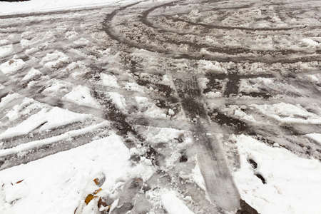 traces of the car on snowの写真素材