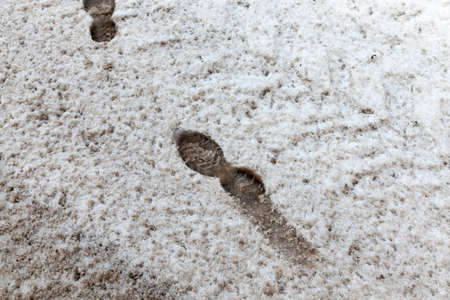 Traces on dirty snowの写真素材