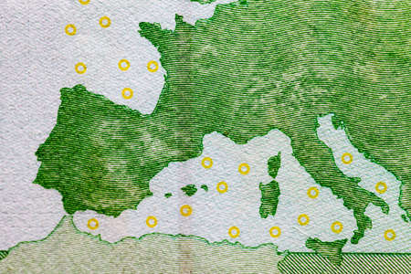 one hundred euros of the European union photographed close-up. Focus on the Europe map of green colorの写真素材
