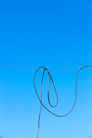 wire with blue skyの写真素材