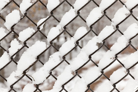 Metal grating covered snow