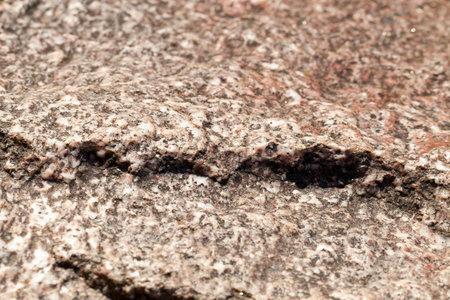 Detail of the old stones of different colors. Photo close-up, small depth of field