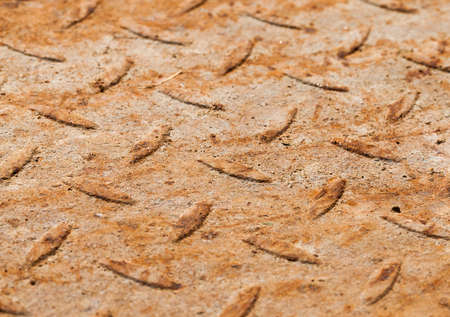 Dirty and rusty metal surface and protrusions for ease of movement and retention, close-up photoの写真素材