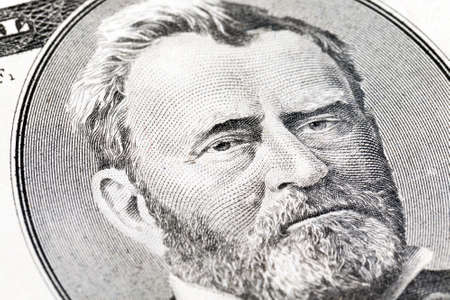 portrait of the president on the obverse of an American banknote of fifty dollars, close-up of a selective focus on the eyesの写真素材