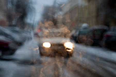 photographed road defocusing , Closeup, visible white car headlight lightsの写真素材