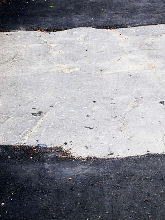 repair of a road made of concrete and asphalt, poor infrastructure in the cityの写真素材
