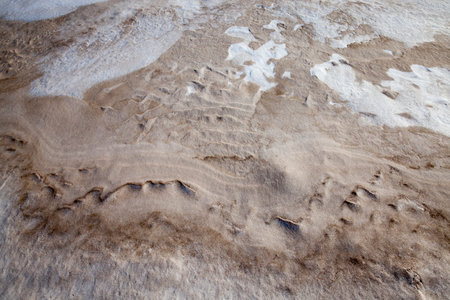 very dirty snow in the winter season, closeup of snowdrifts