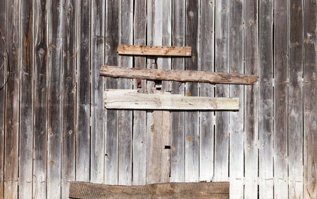 boarded gate in an old building made of pine wood, closeup