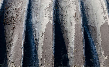 black corrugated part of the wall of the building used for food storage, details and closeupの写真素材