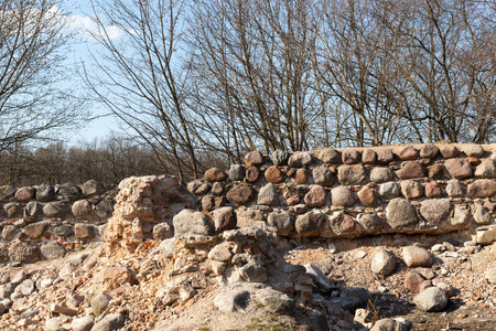 ruins of the ancient fortification, made of concrete and stones with cobblestones, closeup of the...