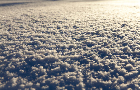 snow makes the street after a snowfall, Winter season, Photo taken closeup with a small depth of...