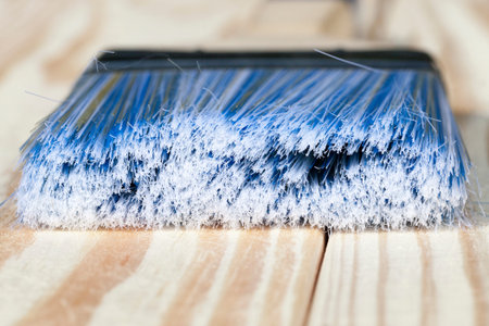 A blue brush for the treatment and protection of wood