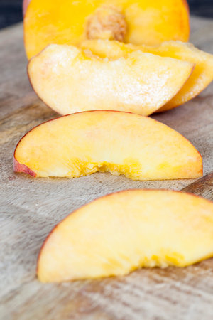 Divided into pieces ripe large yellow peach, cooking