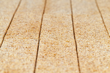 a row of rye crispy loaves, folded in the form of a background, a shallow depth of field