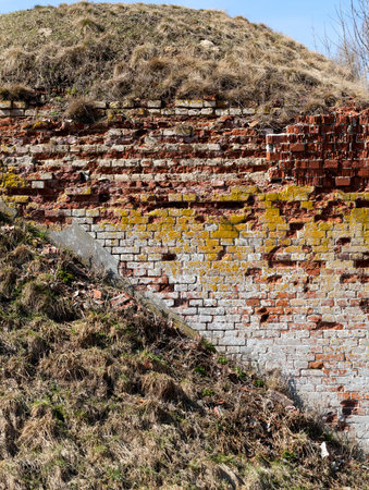 old brick wall of the fortress, destroyed or damaged during the fighting in the war