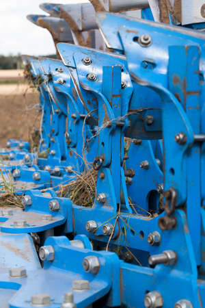 connected a large number of metal parts to a plow for plowing soil on the fieldの写真素材