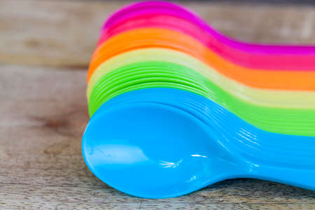 rainbow background of disposable spoons for foodの写真素材