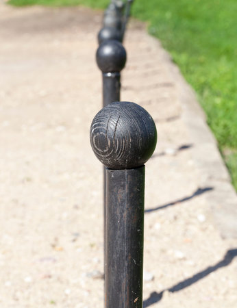 primitive metal stops for traffic with black wooden knobs