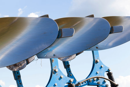 polished steel blades of plows in the field of soil treatment