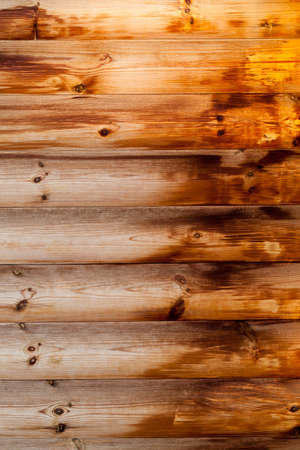 The wet part of the wooden wall of the building is made decorative for decorationの写真素材