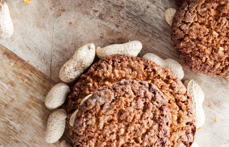 Oatmeal cookies with peanuts closeup, products for tea or coffee dessert