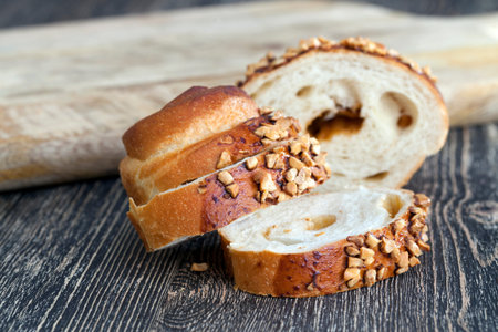 On pieces Wheat bun sweet with a stuffing and strewed with the fried peanuts
