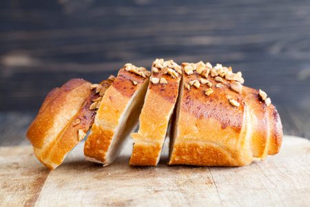 On pieces Wheat bun sweet with a stuffing and strewed with the fried peanutsの写真素材