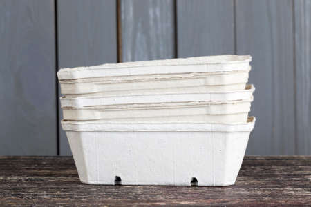 several cardboard boxes for packing the harvest of berries, made from recycled waste paper, materials are made with care for the environmentの写真素材