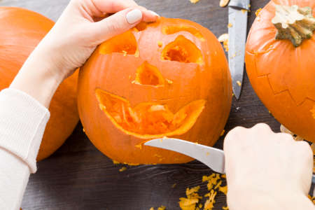 orange pumpkin lamp made in autumn for the celebration of the holiday of Halloween, homemade pumpkin made by yourselfの写真素材