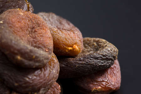 beautiful dried apricots without the use of chemical reagents to improve the color of dried fruits, close - up of traditional sweets natural dryingの写真素材