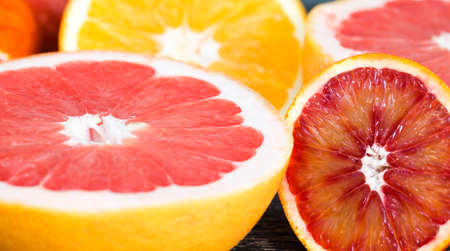 red orange delicious orange fruit, cut into halves during the preparation of dessertsの写真素材