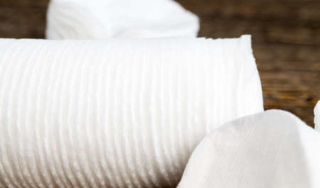 white cosmetic discs made of cotton and used for cosmetic purposes in women cosmetics, close-up of natural cosmetic thingsの写真素材